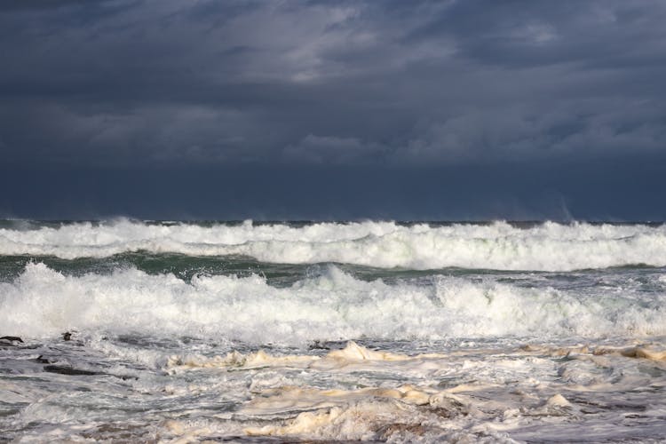 Ocean Waves Under Dark Clouds