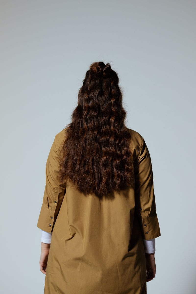 Woman with curly hair from behind