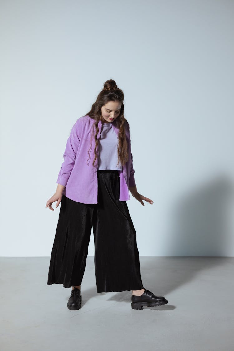 Woman In Purple Button Down Shirt Looking Down