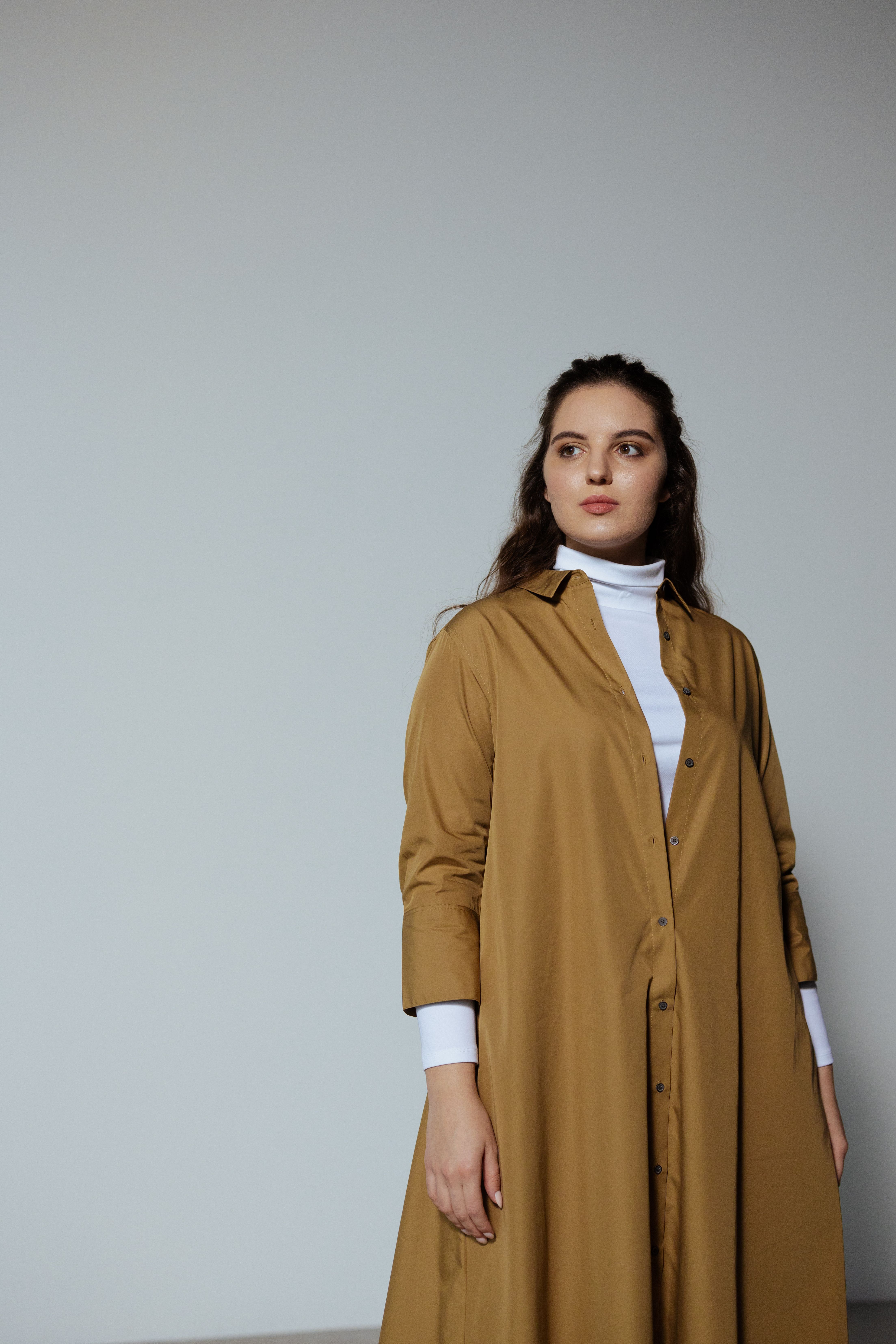 Photo of a Woman in a Brown Coat · Free Stock Photo