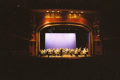 An Orchestra Performing on Stage