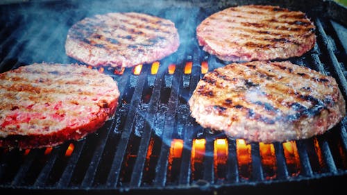 Free Shallow Focus Photo of Patties on Grill Stock Photo