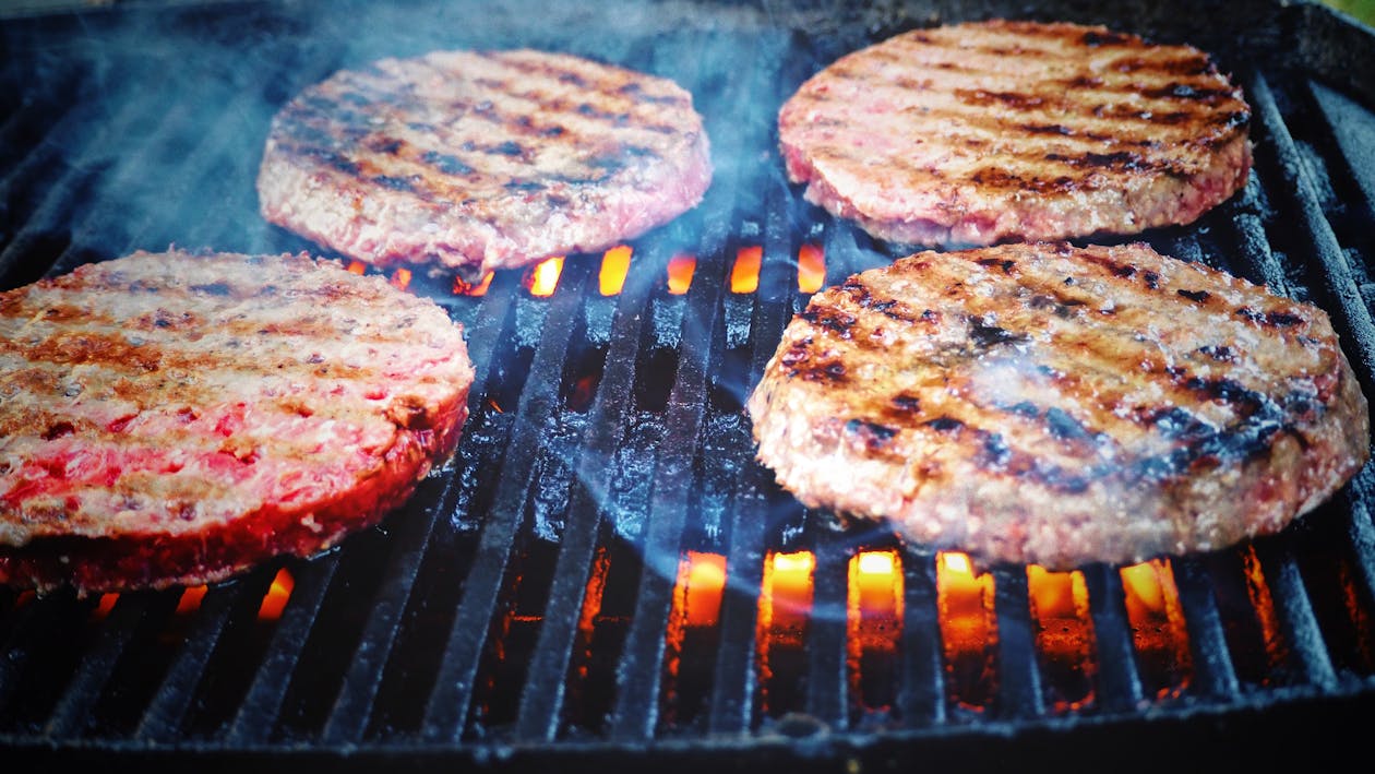 Free Shallow Focus Photo of Patties on Grill Stock Photo