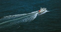 White and Red Boat on Sea