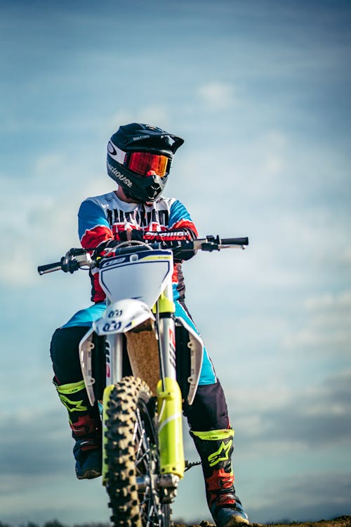 A Person Sitting on a Dirt Bike with Arms Crossed