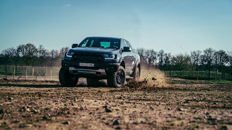 Ford Ranger Driving On Dirt Road