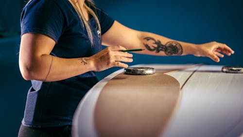 Free A Tattooed Person Holding a Pencil Stock Photo