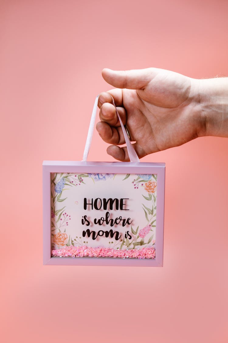 A Person Holding A Shadow Box