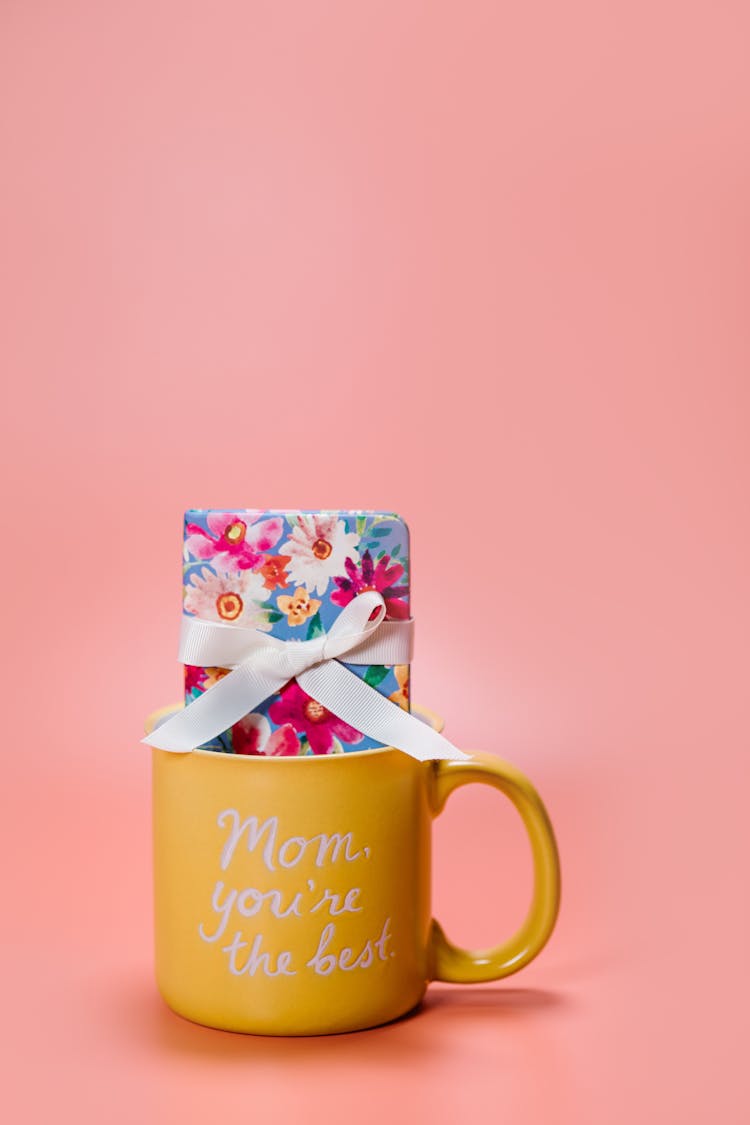 Printed Words On A Yellow Ceramic Mug 