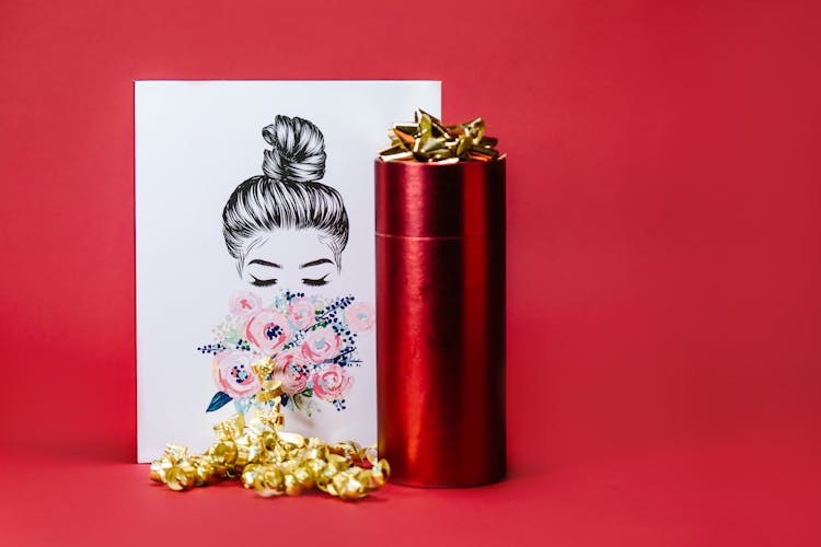 Greeting Card And A Cylindrical Gift Box