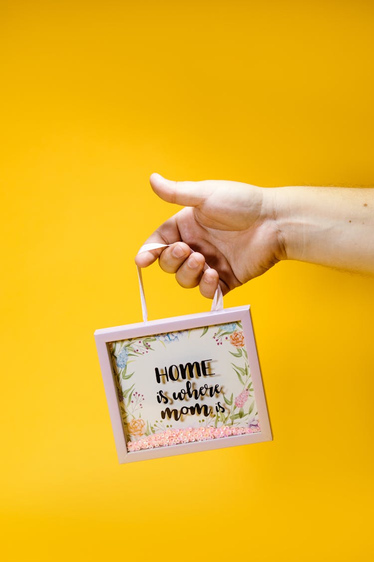 Hand Holding A Shadow Box