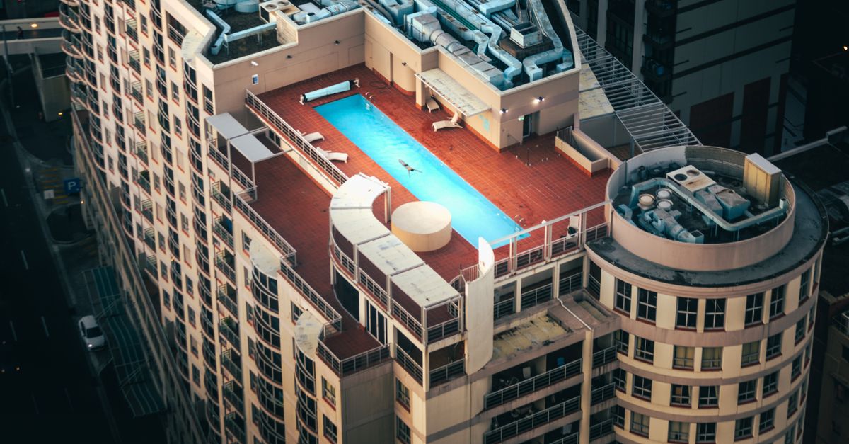 Aerial shot of a rooftop swimming pool on a Sydney building, showcasing urban luxury.