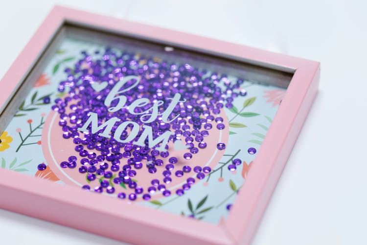 Purple Sequins Inside A Shadow Box