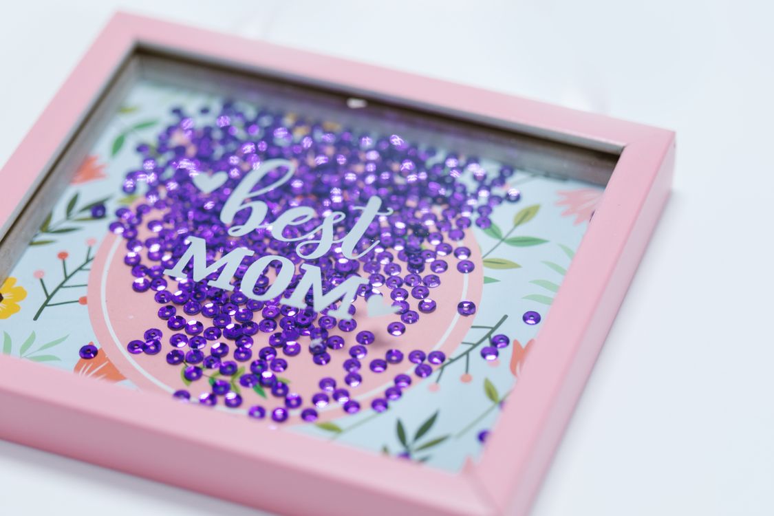 Pink Slip Shadow Box Purple Sequins inside a Shadow Box · Free Stock Photo