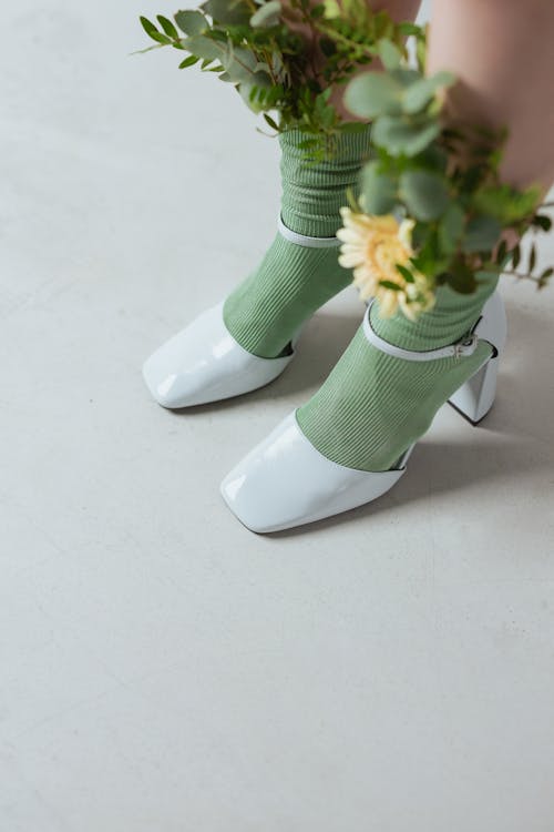Free A Person Wearing Green Socks and High Heels Stock Photo