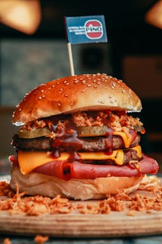 Delicious loaded burger with bacon, cheese, and crispy onions for food lovers.
