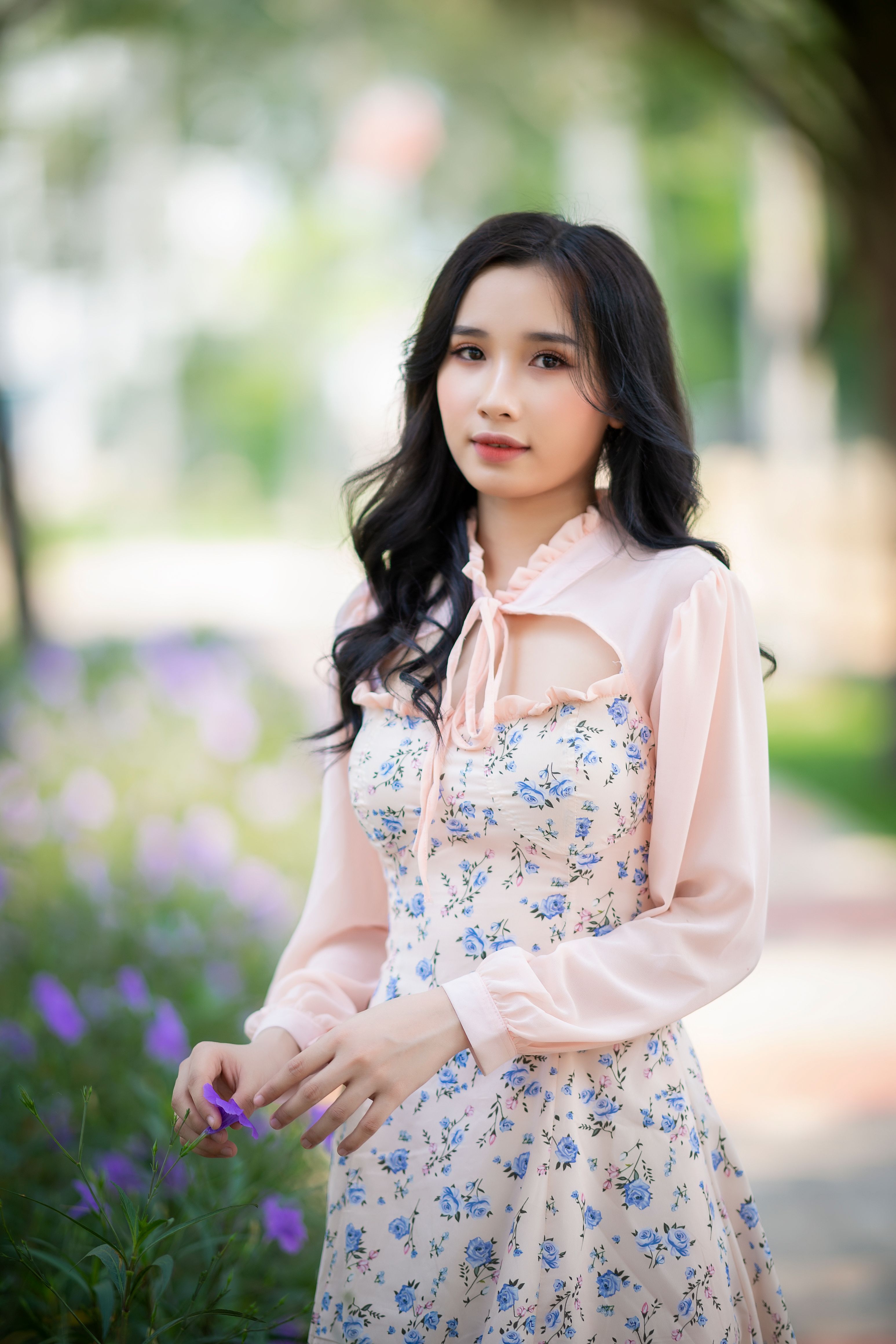 A Woman Wearing a Pink Floral Dress · Free Stock Photo