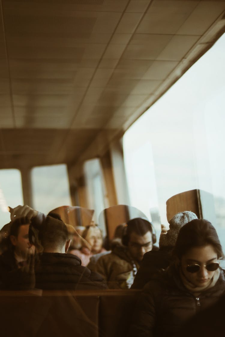 Passengers Sitting In Landing Stage While Waiting For Ferry