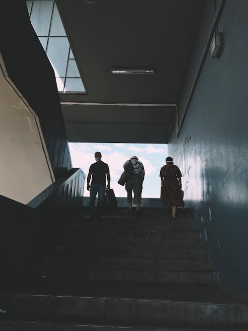 People Walking on a Staircase