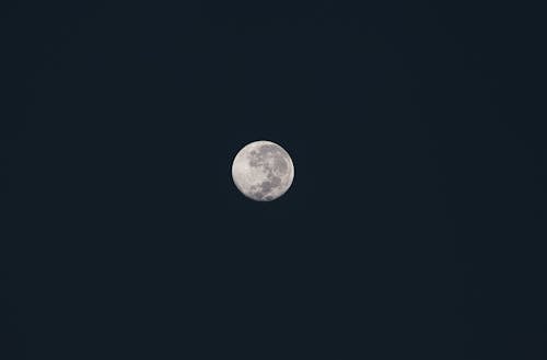 Free A Full Moon on a Dark Sky Stock Photo