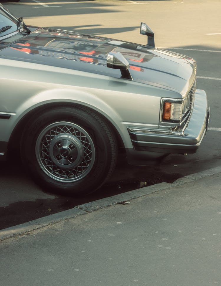 A Car On A Parking Space Beside A Curb