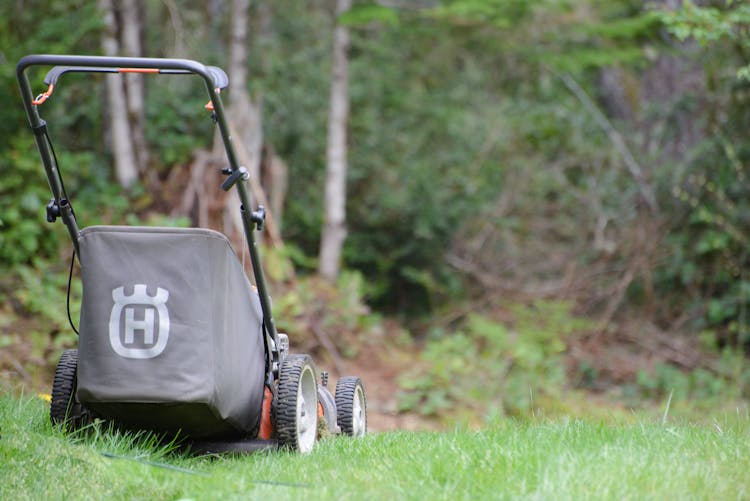 A Lawn Mower On The Grass 