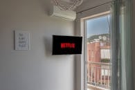A Wall Mounted Television Turned On