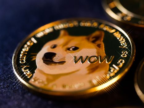 Detailed close-up image of a shiny Dogecoin cryptocurrency coin with the iconic Shiba Inu dog. — photo by Rūdolfs Klintsons