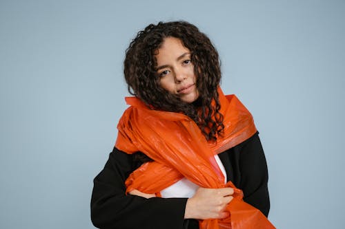 A Woman in Black Long Sleeves Holding a Plastic