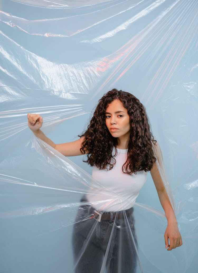 Woman Tearing The Plastic