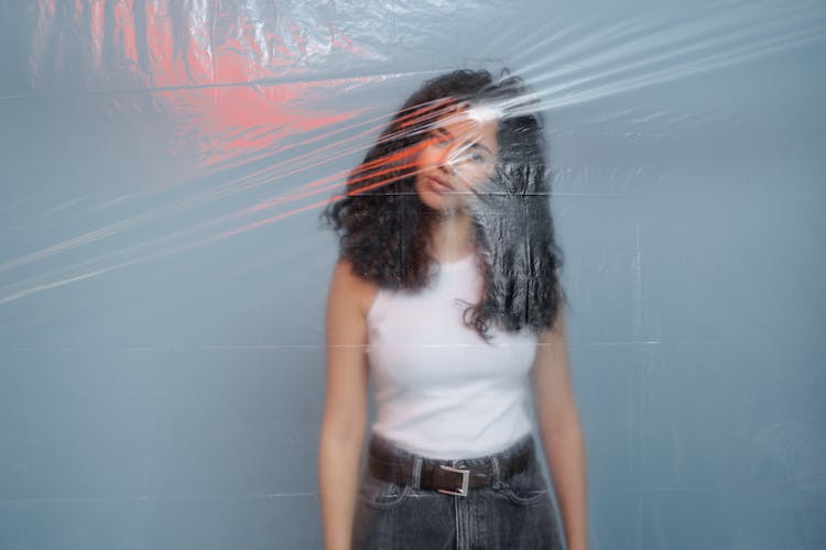 Young Woman Closed Behind Plastic Wrap