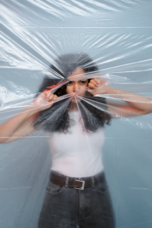 Woman Tearing the Plastic