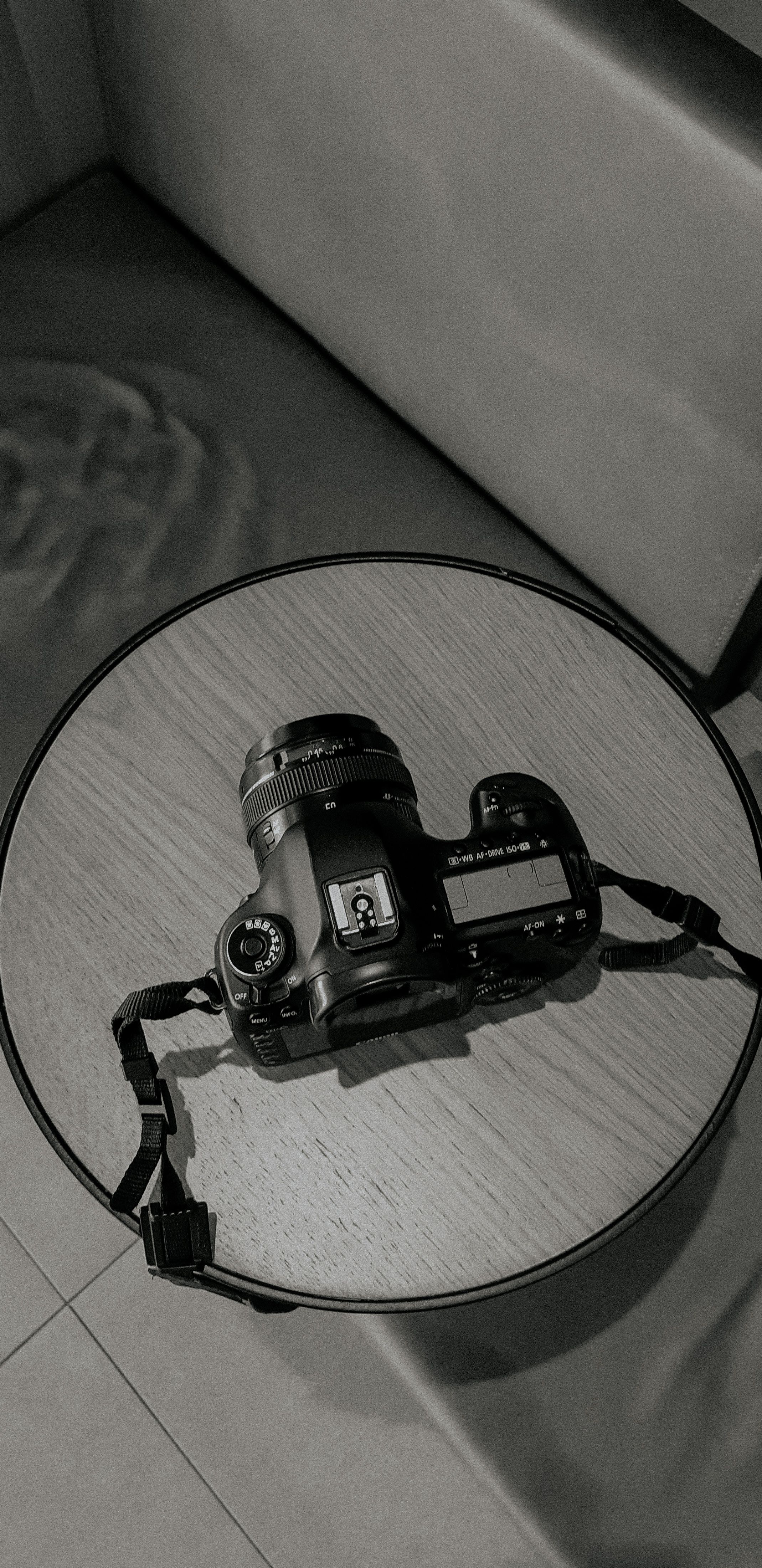 Top View of a Digital Camera on a Gray Table · Free Stock Photo