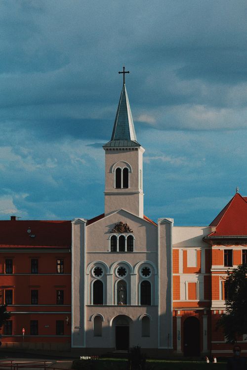Free A beautiful view of a church with classic architecture in Budapest under a vibrant summer sky. Stock Photo
