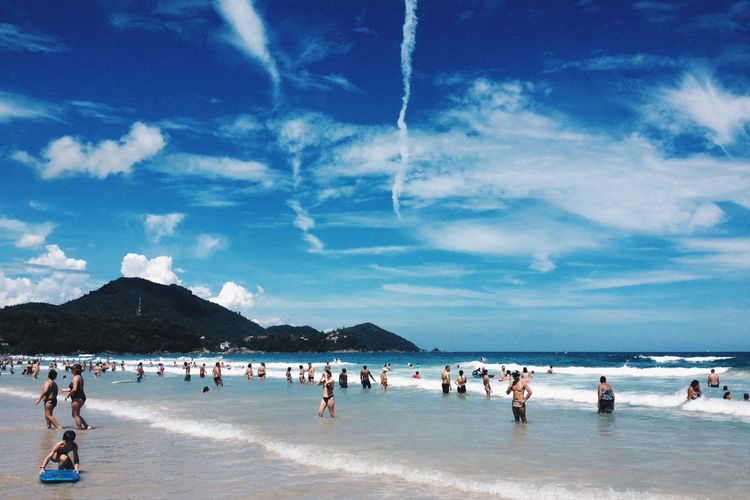 Beach with mountains, sky, and coastline in Ubatuba, São Paulo, Brazil.