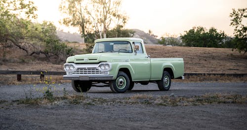 Light Green Pick Up Truck on Road