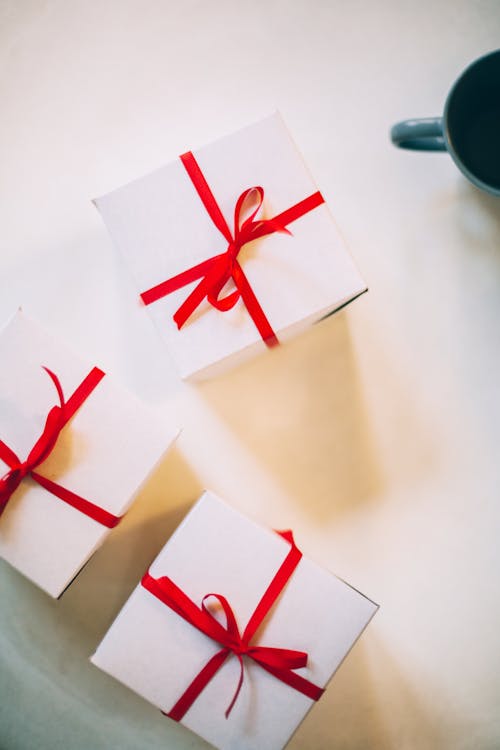 Free Photography of Three Boxes With Red Ribbons Stock Photo