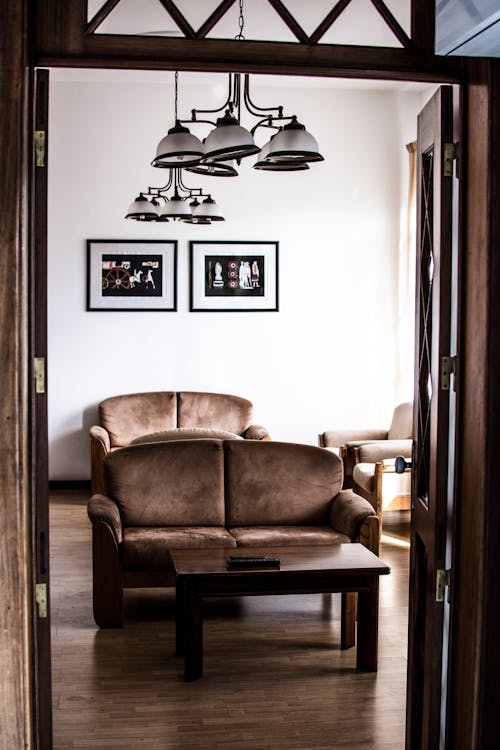 Brown Coffee Table in Front of Brown Padded Loveseat