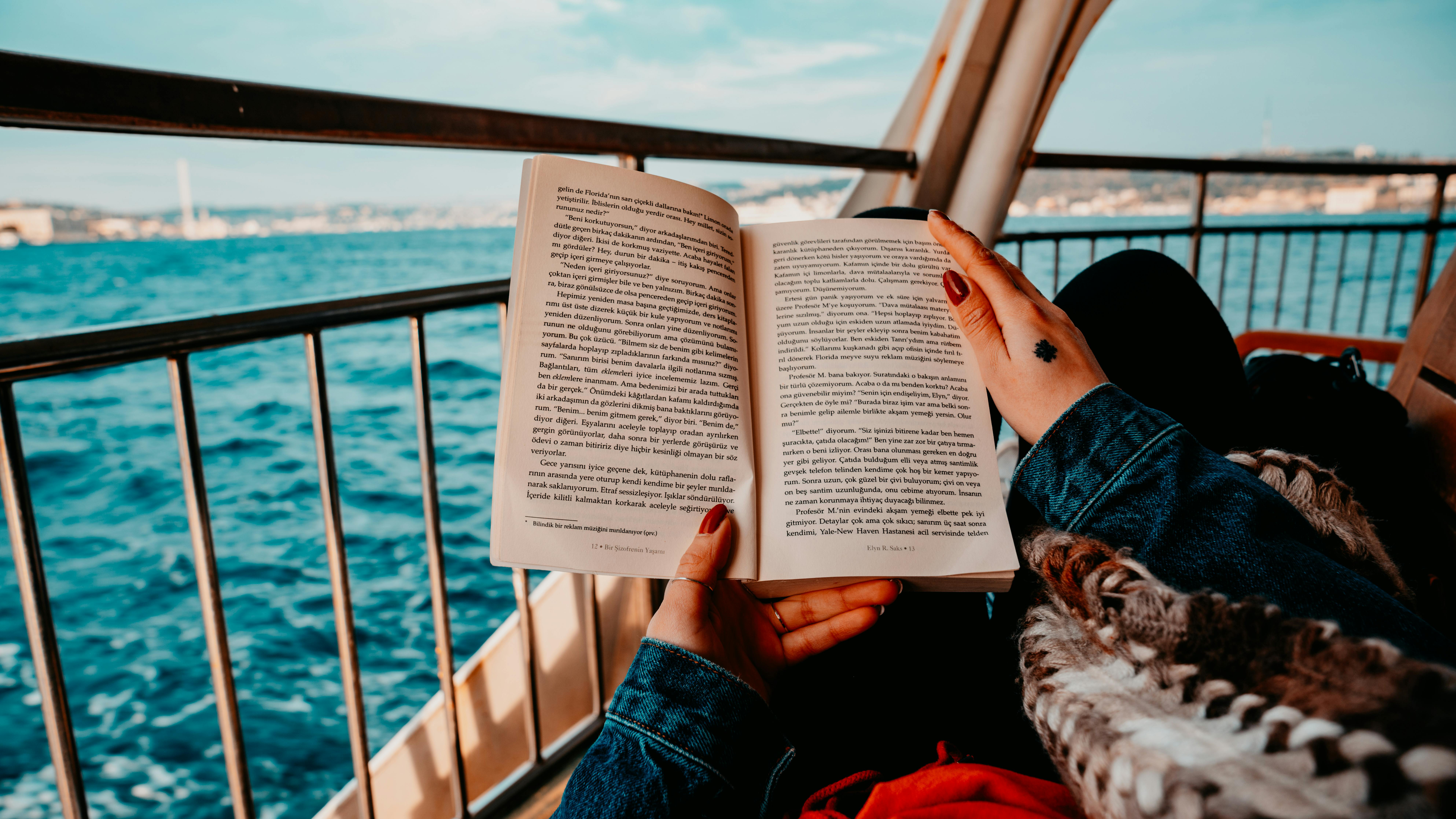 A person reading a book on the beach. Read reading open book. - PICRYL -  Public Domain Media Search Engine Public Domain Image