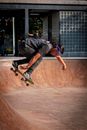Man in Black T-shirt and Blue Denim Jeans Doing Skateboard Stunts