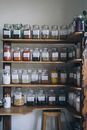 Clear Glass Jars on Wooden Shelf