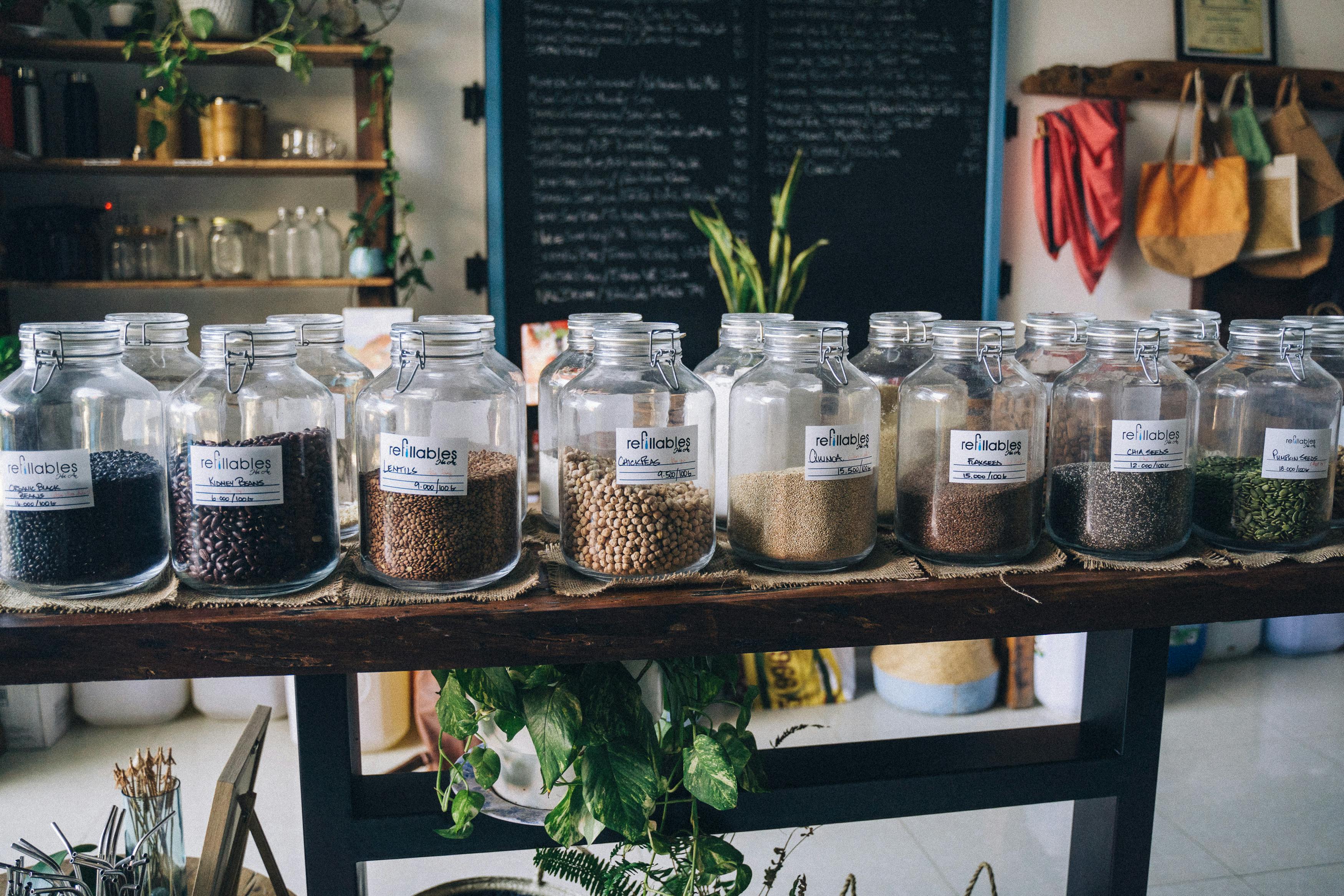 Assorted Jars on Blue Shelf Cabinets · Free Stock Photo