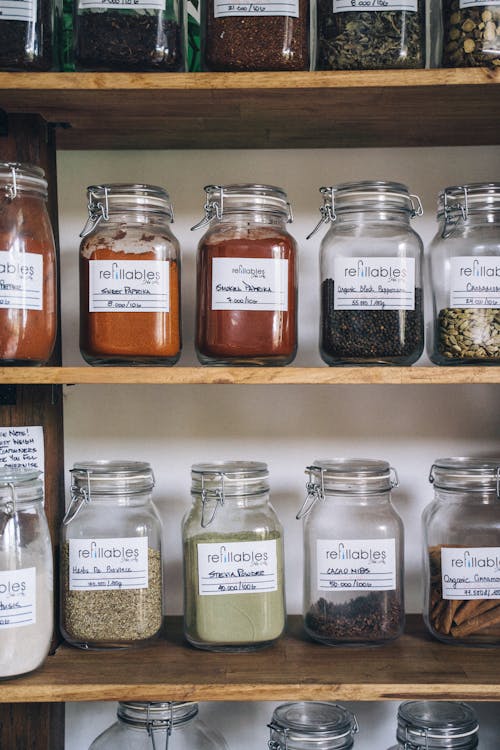 Free Assorted Glass Jars on Wooden Shelf Stock Photo
