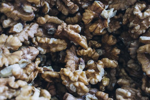 Detailed close-up of shelled walnuts showcasing their rich texture and natural colors.