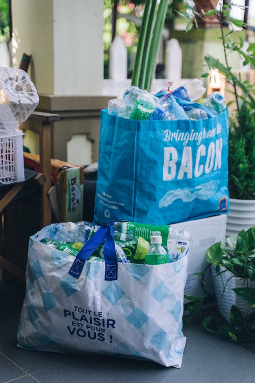 Free Recyclable Plastic Bottles in Tote Bags Stock Photo