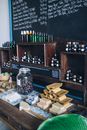 Clear Glass Jars on Brown Wooden Shelf