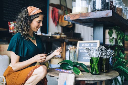 A Woman Holding a Drinking Straw