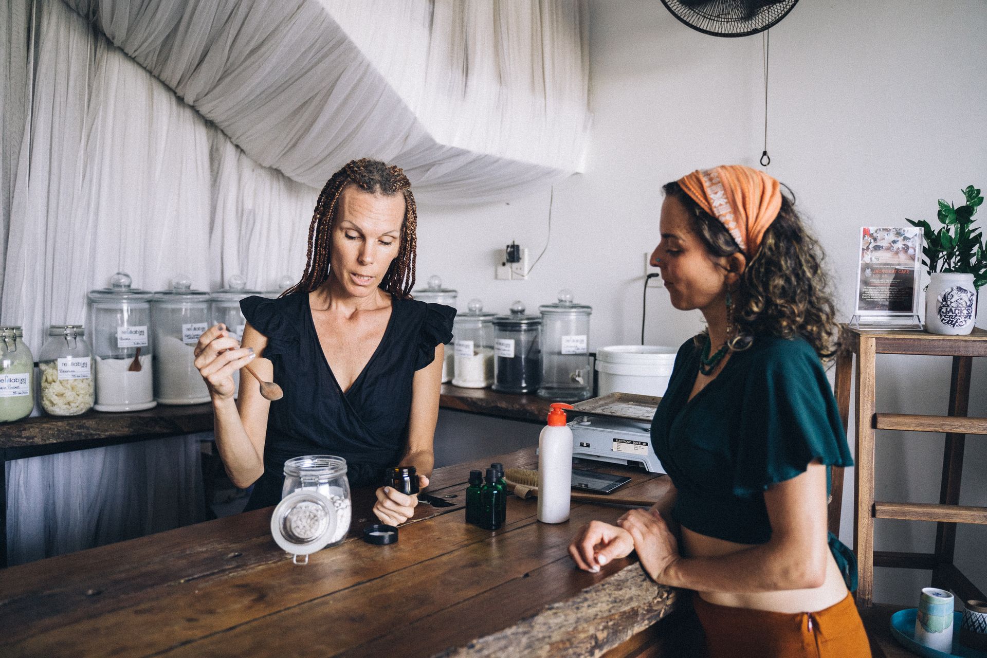 A Woman Explaining a Product to a Customer