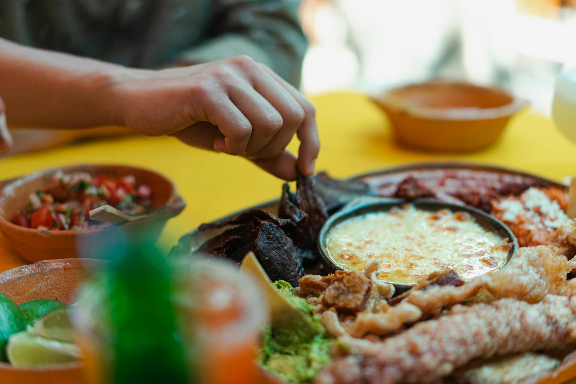 Person Eating Mexican Food