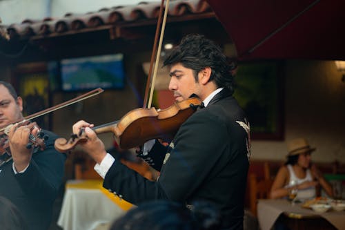 Free Man in Black Suit Playing Violin Stock Photo